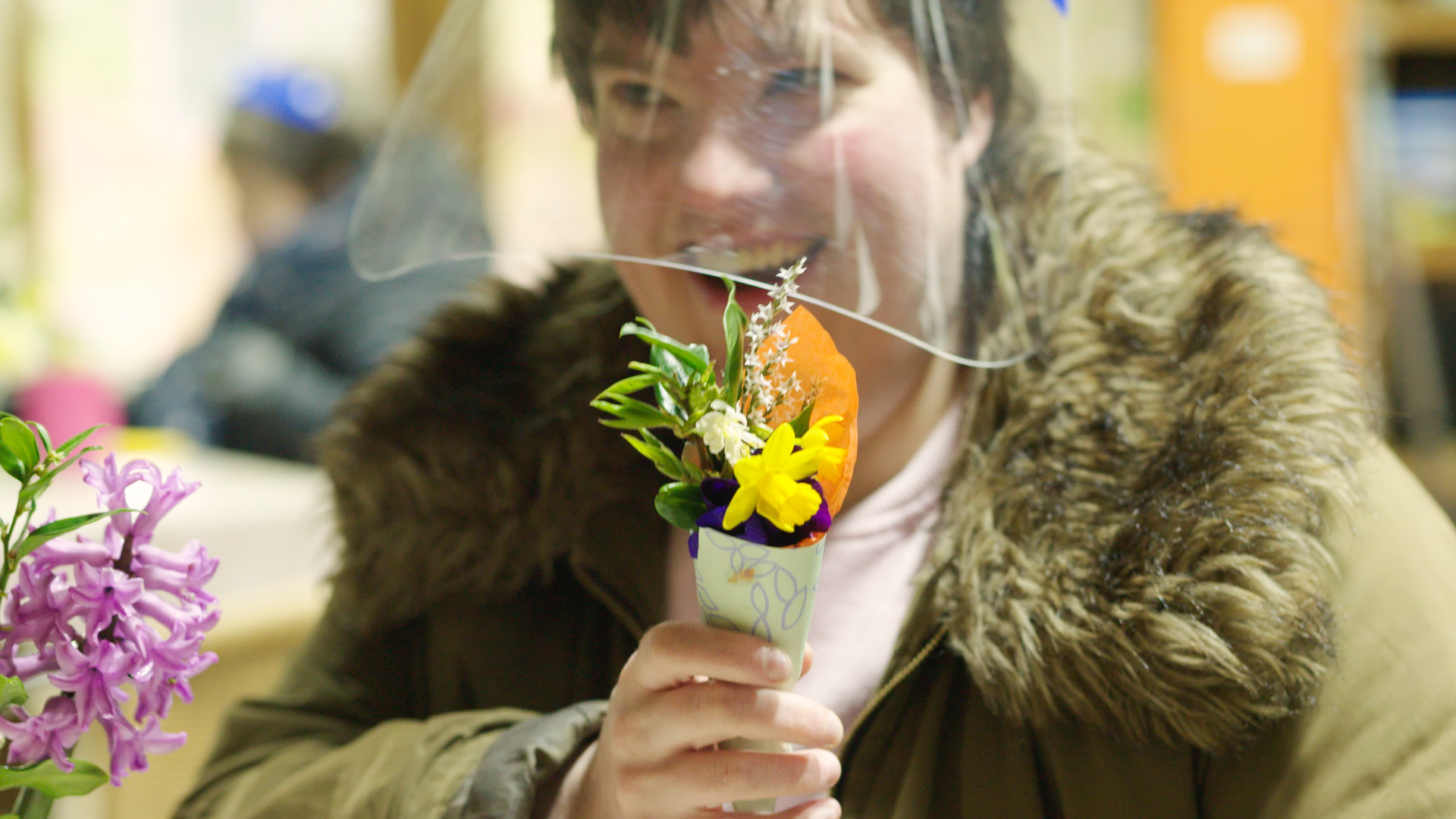 Chelsea at Flower Pod holding a bunch of flowers