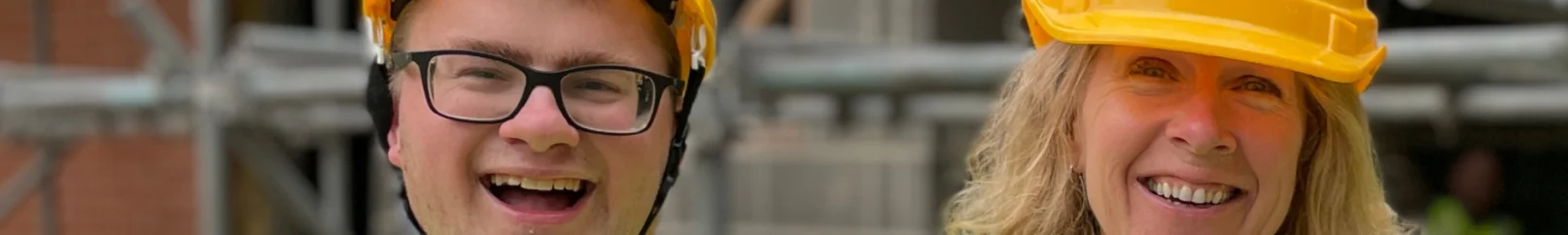two people wearing hard hats